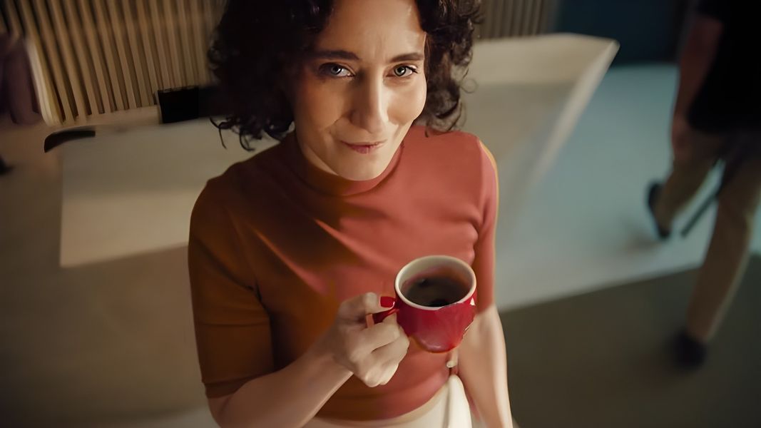 A regional director with her morning coffee